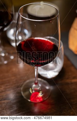 Dinner With Glass Of Dry Red Wine In Italian Osteria Restaurant