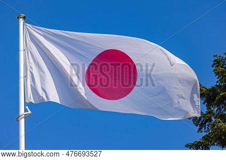National Flag Of Japan Nisshoki At Blue Sky
