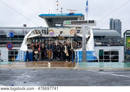 Amsterdam, The Netherlands - 8 September 2022: People Leaving A Gvb Ferryboat