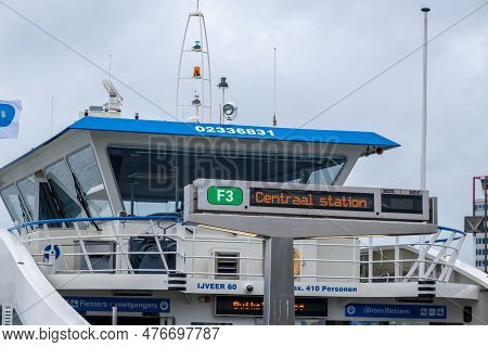 Amsterdam, The Netherlands - 8 September 2022: People Going Into A Gvb Ferryboat
