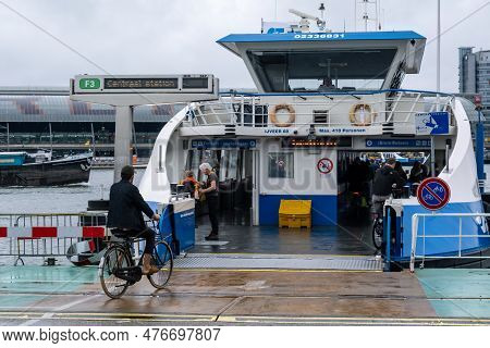 Amsterdam, The Netherlands - 8 September 2022: People Going Into A Gvb Ferryboat