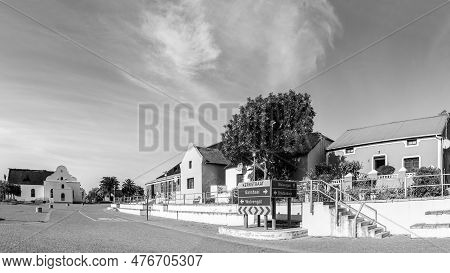 Elim, South Africa - Sep 21, 2022: A Street Scene, With Historic Houses, A Business And The Moravian