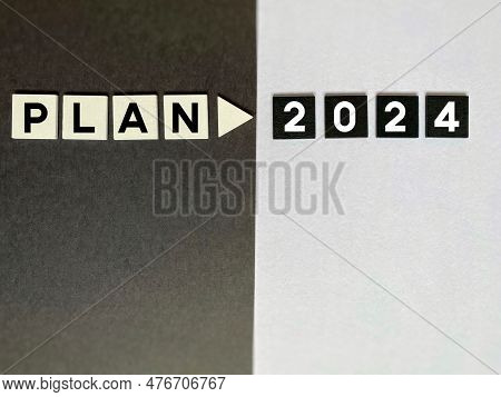 Plan 2024 Text On Blocks With Blackand White Color Background. New Year's Resolutions Concept.