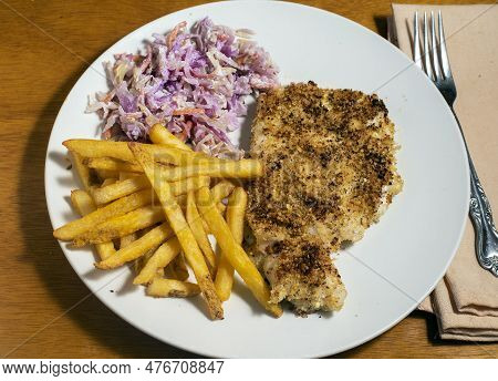Baked Haddock  Served With  French Fries And Cole Slaw