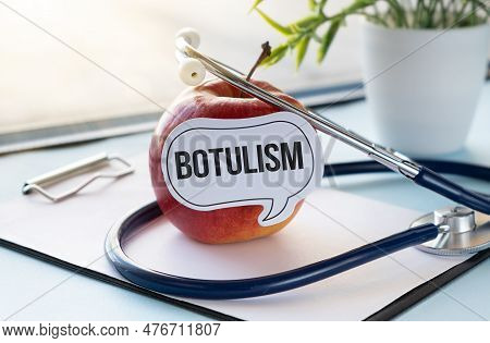 Red Apple With Text Botulism And Measuring Tape On Background