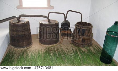 An Old Ukrainian Moonshine Machine. Equipment For The Production Of Homemade Strong Alcohol.