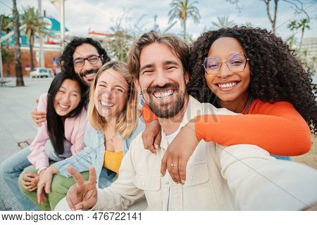 Group Of Multiracial Friends Smiling And Taking A Selfie Portrait. Young People Having Fun On A Soci