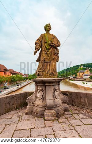 Wurzburg, Germany - July 11, 2021: St. Totnan Statue At Old Main Bridge Or Alte Mainbrucke In Wurzbu