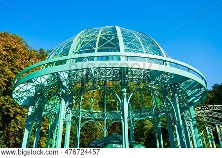 Borjomi, Georgia - September 01, 2021: Glass Pavilion Above Hot Spring Of Mineral Water In Borjomi C