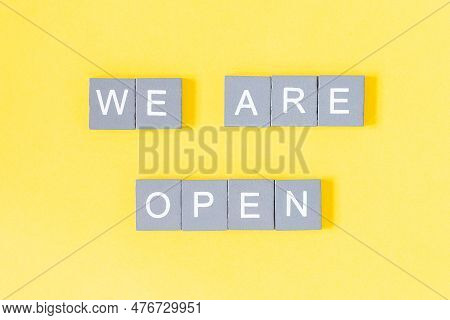 We Are Open Quote, Welcome Sign For Business Or Caffe, Wooden Letters On Yellow Background, End Of Q