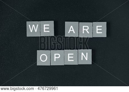 We Are Open Quote, Welcome Sign For Business Or Caffe, Wooden Letters On Black Background, End Of Qu