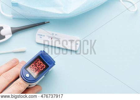 Pulse Oximeter Measuring Oxygen Saturation In Blood And Heart Rate.  Pulse Oximeter On The Patient's
