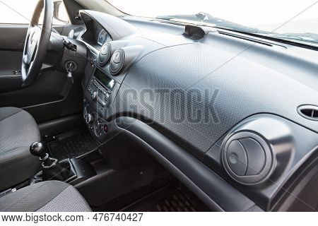 Interior View With Steeering Wheel And Dashboard Of Luxury Very Expensive New White Car Stands In Th