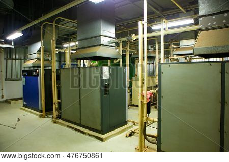 The Factory Walkway And Machine For Processing Metal Part Of Car. Warehouse And Store Keep Material 