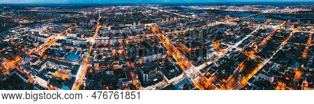 Brest, Belarus. Cityscape Skyline In Evening Illuminations. Night Birds-eye View Of Brest Market And