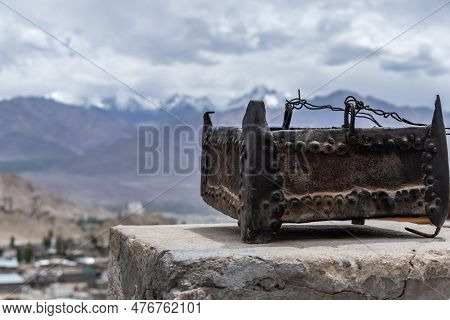 Mountain Life Concept Showing A Portable Fire Pot On The Roof & Himalayas Behind.