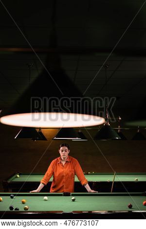 Sports Game Of Billiards On A Green Cloth. Female Player With A Cue. Active Leisure And Entertainmen