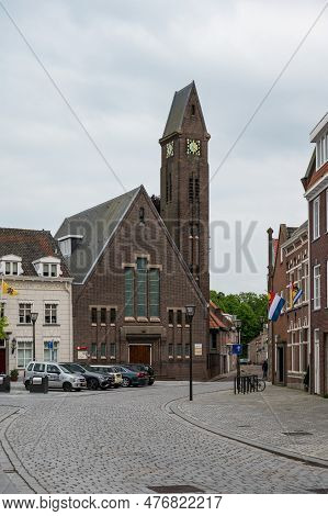 Hulst, Zeeland, The Netherlands - May 21, 2023 -  The Old Market Square With Cobble Stones And A Cat
