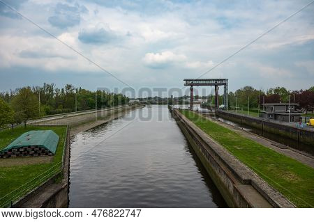 Dendermonde, East Flanders, Belgium - May 1, 2023 - Sluice And Vessels At The River Dender