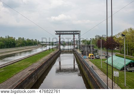Dendermonde, East Flanders, Belgium - May 1, 2023 - Sluice And Vessels At The River Dender