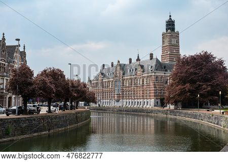 Dendermonde, East Flanders, Belgium - May 1, 2023 - The Banks Of The River Dender With The Building 