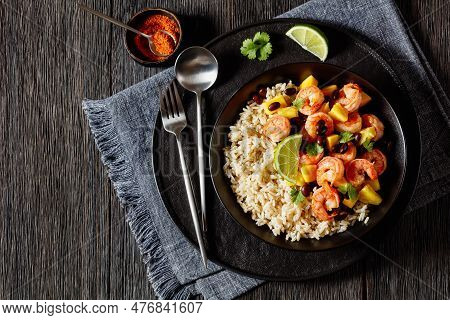 Caribbean Grilled Shrimps With Black Beans, Mango Pineapple Chunks Served With Brown Rice In Black B