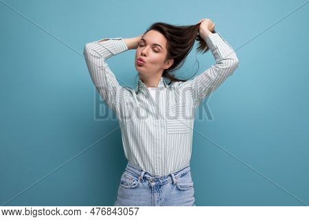 Joyful 25 Year Old Brown-haired Woman With Well-groomed Silky Hair After Hairdresser Work