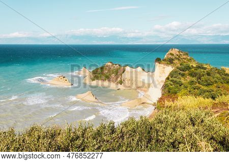 Beautiful Panoramic View Of Cape Drastis And Turquoise Sea Waves On Corfu Island In Greece
