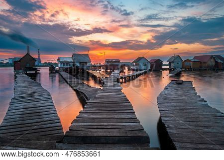Small Fishing Cottages In The Sunset On Bokod Lake In Hungary.