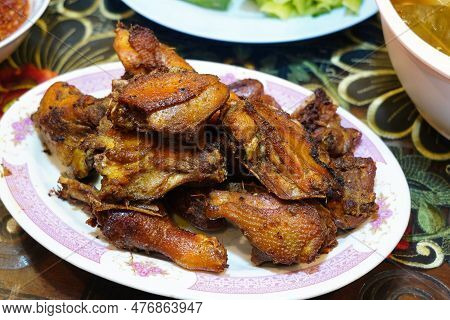 Indonesian Traditional Fried Chickens Served On A White Plate.