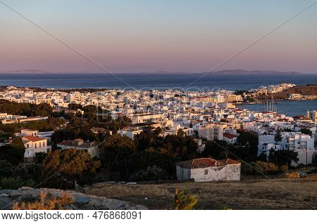 View On The City Of Tinos From The Hill During Sunset. City Centre And Streets Of Village Of Tinos W