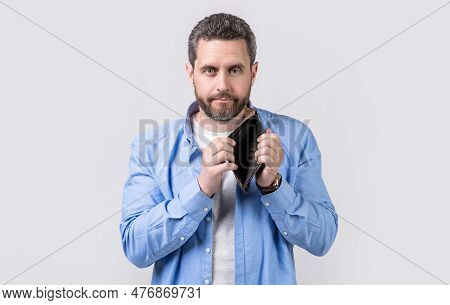 Moneyless Guy With Empty Wallet In Studio. Moneyless Guy With Wallet At Hand.