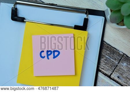 Concept Of Cpd Write On Sticky Notes Isolated On Wooden Table.