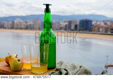 Traditional Natural Asturian Cider Made From fermented Apples In Wooden Barrels Should Be Poured Fro