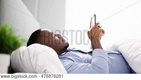 African Man Holding Smartphone Or Mobile Phone