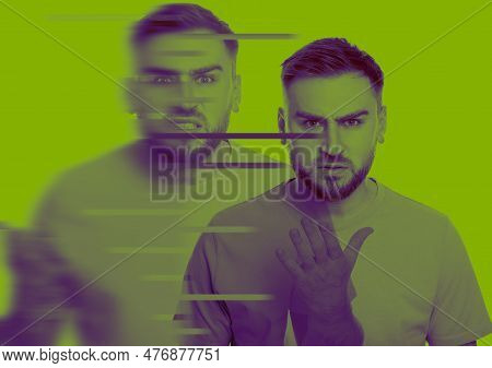 Man Suffering From Paranoia On Yellow Green Background, Color Toned. Glitch Effect