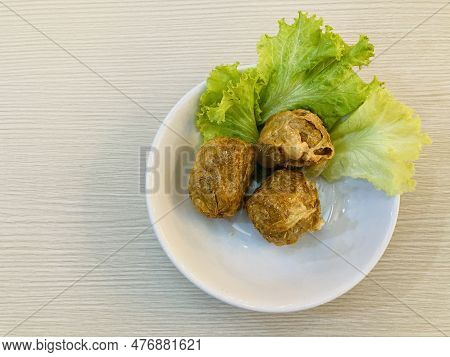 Three Pieces Of Deep-fried Crab Meat Rolls Or 
