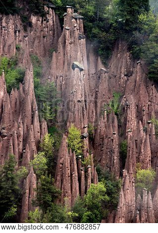 Landscape View Of The Earth Pyramids Renon In The Morning Fog Near The City Of Bolzano In The Dolomi