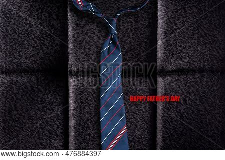 Happy Father's Day. Tie, And Words On A Black Leather Background. Fathers Day Concept. Festive Backg
