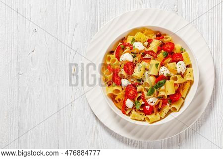 Roasted Pepper Tomato Mozzarella Pasta Salad In White Bowl On White Wood Table, Horizontal View From