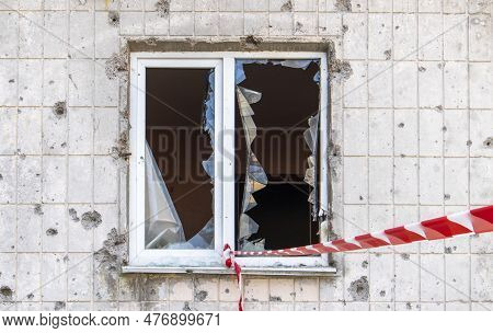 Window Of The House With Broken Glass. Selective Focus. The Windows In The Apartment Building Were D