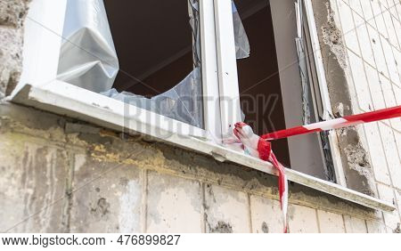 Window Of The House With Broken Glass. Selective Focus. The Windows In The Apartment Building Were D