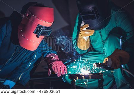 Metal Welding Steel Works Using Electric Arc Welding Machine To Weld Steel At Factory. Metalwork Man