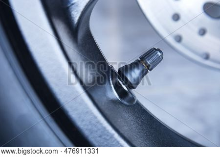Motorcycle Tire Valve. Close-up Of Tire Valve Stem On Motorcycle Wheel With Selective Focus.