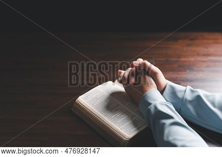 Woman Hands Praying To God With The Bible. Woman Pray For God Blessing To Wishing Have A Better Life