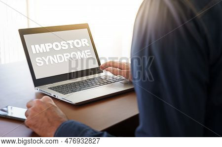 Impostor Syndrome Text Displayed On A Modern Laptop