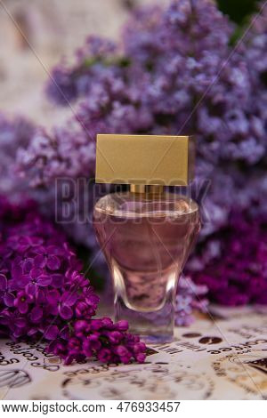 Perfume Among Lilac Flowers,  A Bottle Of Perfume Among The Flowers