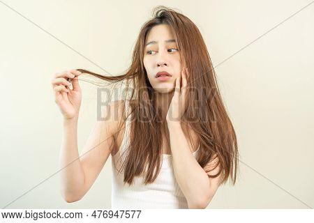 Damaged Hair, Frustrated Asian Young Woman, Girl Hand In Holding Splitting Ends, Messy Unbrushed Dry