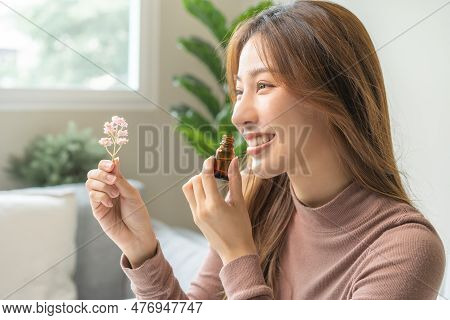 Aromatherapy, Cute Asian Young Woman, Girl Holding Flower, Bottle Of Essential Perfume Oil, Enjoying