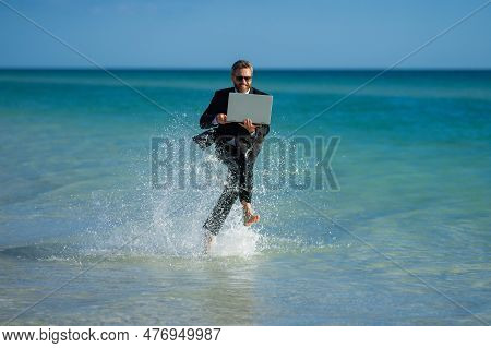 Excited Summer Business Travel. Freelance Work, Online Working. Summer Businessman In Suit Run In Se